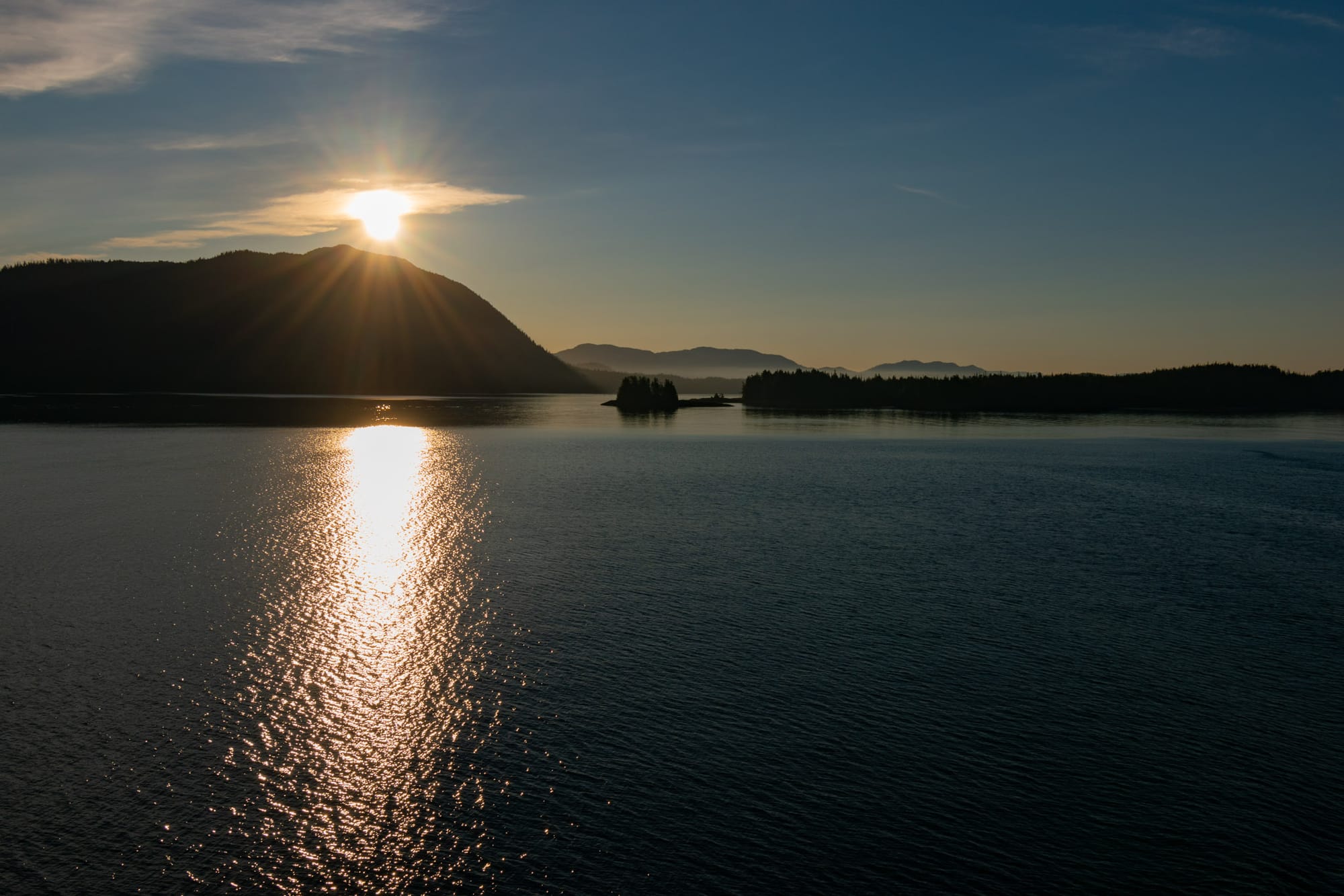 Photo of tree covered islands and mountains in the Inside Passage.