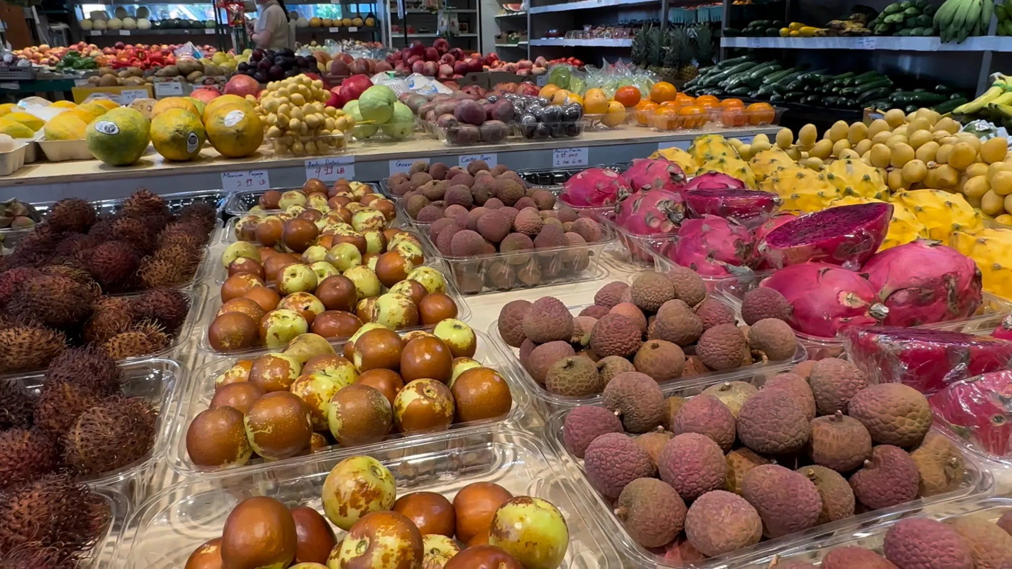 Photo of Granville Island Public Market produce vendor.