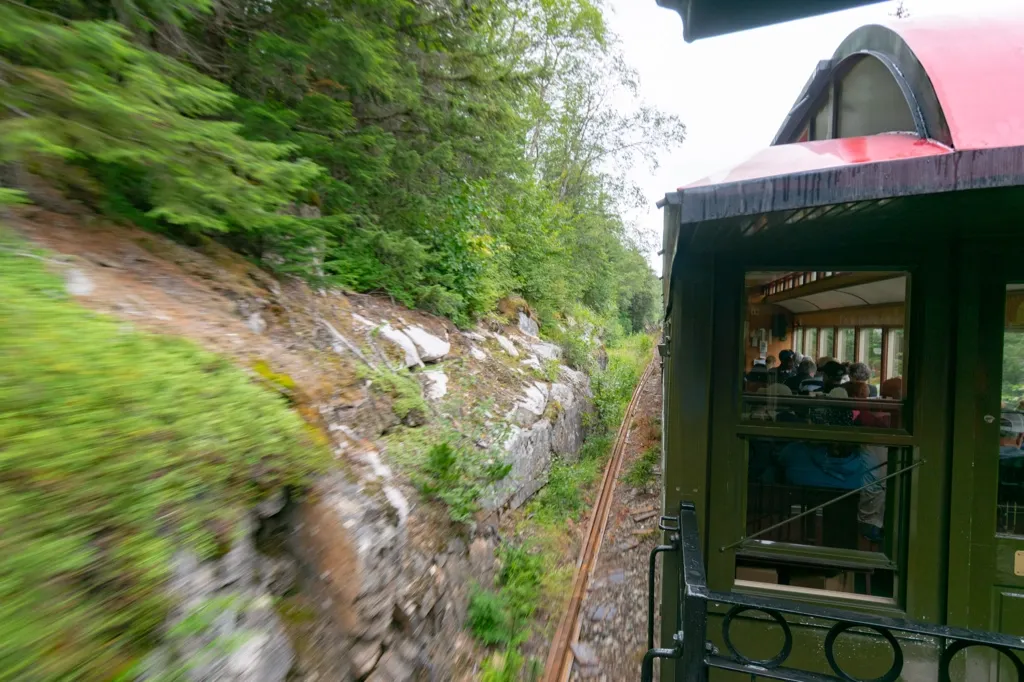 Photo of White Pass Train close cliffs