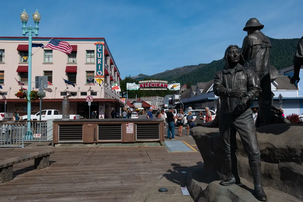 Photo of entrance to Ketchikan from pier and The Rock statue