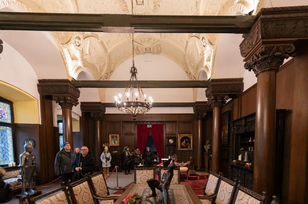 Photo of a more formal dining hall with armor and art work on display