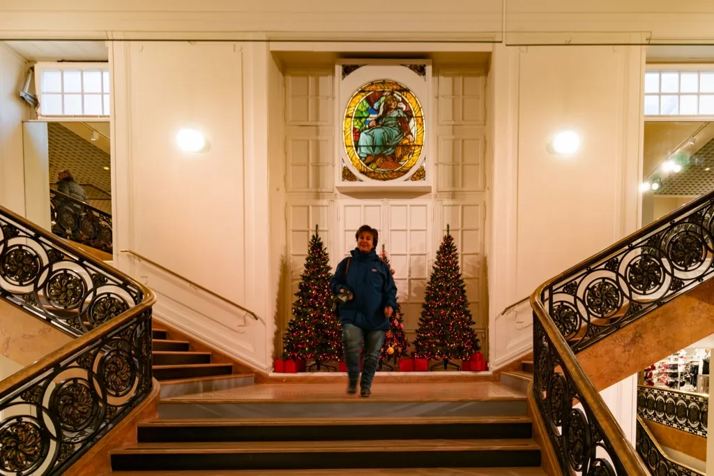 Photo of Galina on the stairs at Lafayette Depertment Store